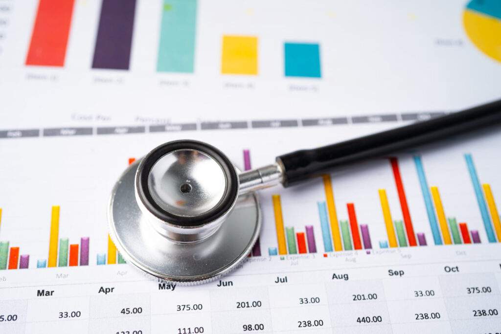 stethoscope on charts and graphs spreadsheet paper 2023 11 27 05 26 45 utc scaled
