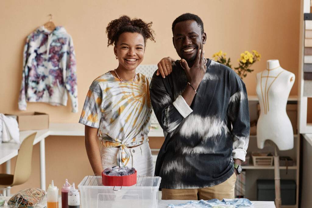 happy young male and female designers in tie dye t 2023 11 27 05 09 01 utc scaled